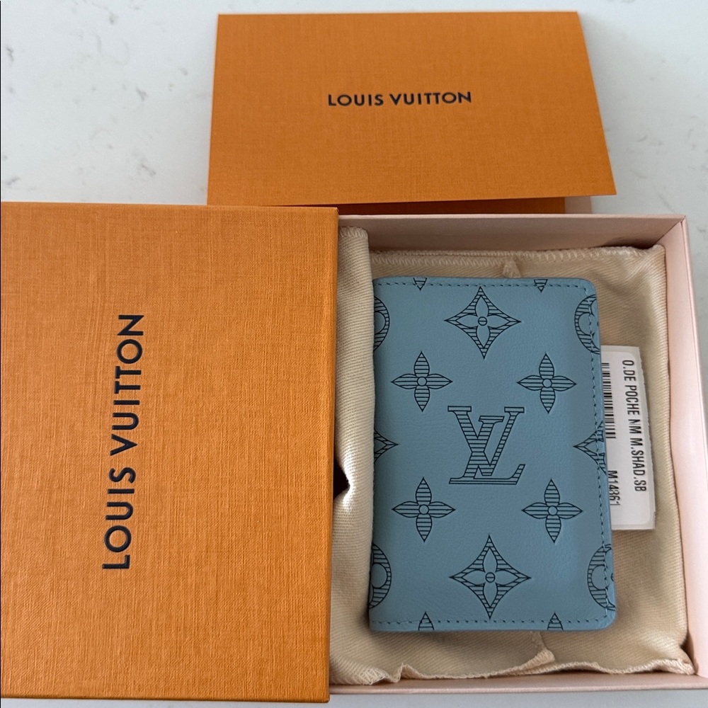 Authentic Louis Vuitton Pocket Organizer in Light Blue Monogram Shadow leather